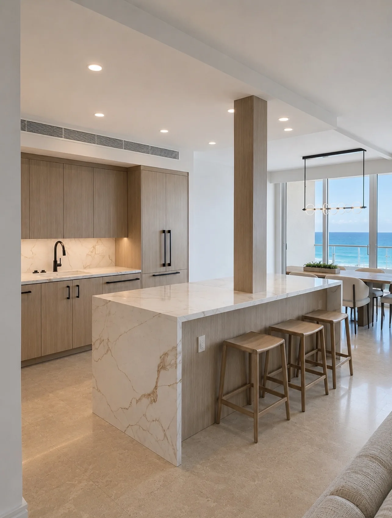 Light wood kitchen with waterfall island and ocean view