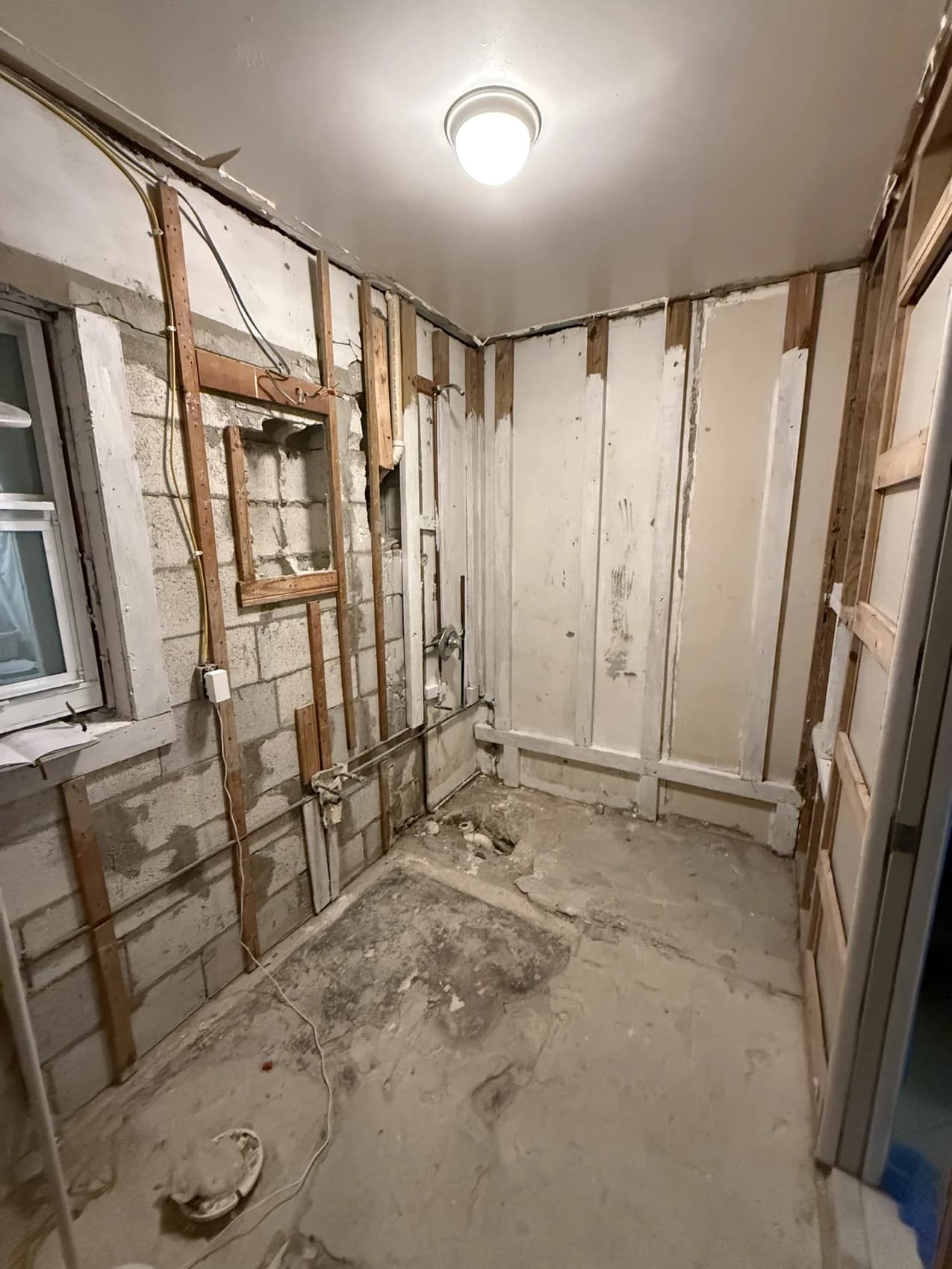 Wide view of bathroom during demolition