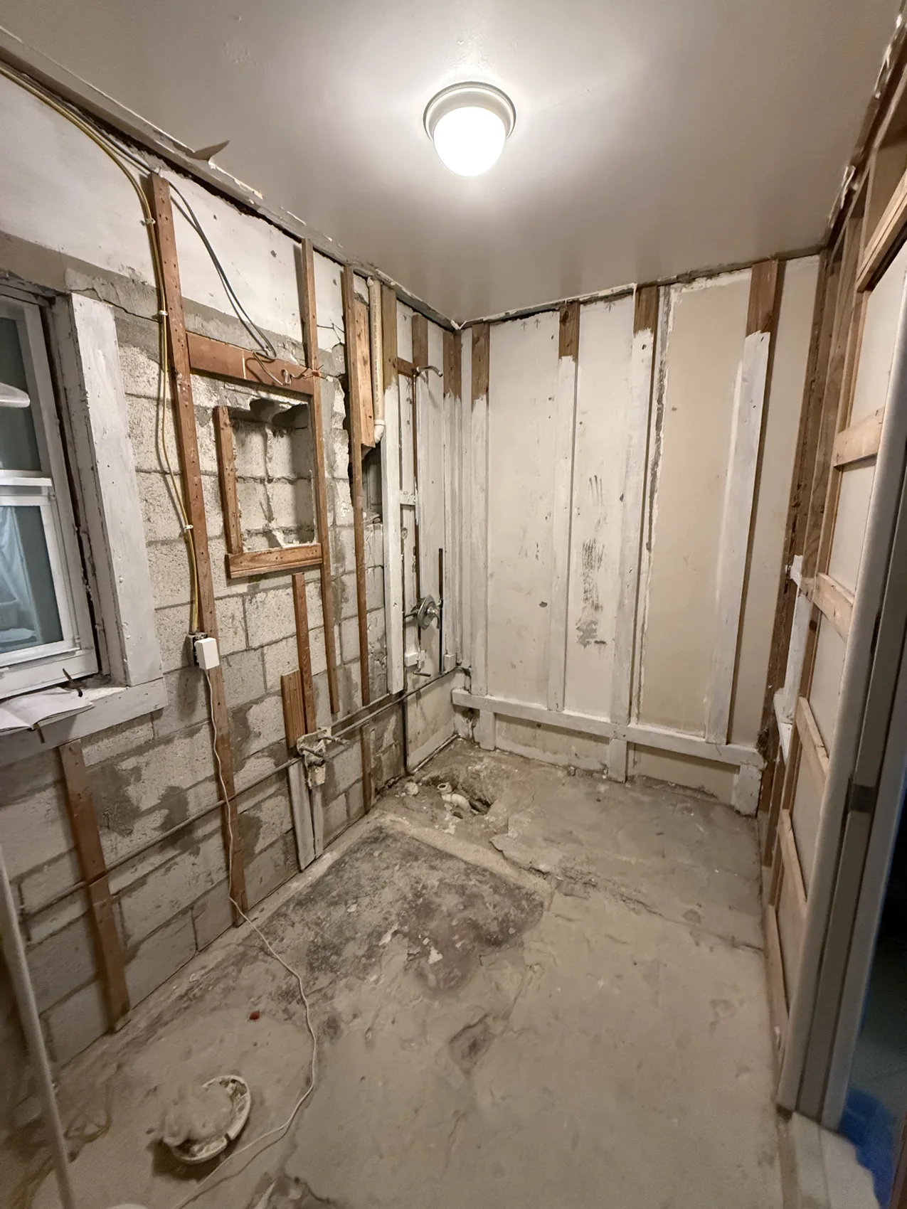 Wide view of bathroom during demolition